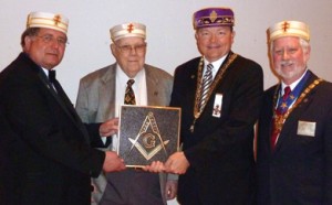 Ill. John Mason Chambliss, Jr., 33°, George Everett Dewese, 33°, James Dean Cole, 33°, and Kerford “Kerry” Campbell, 33°, with the bronze plaque presented by Ill. Dewese.